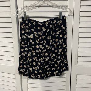 Light weight floral skirt with zip up back. Never worn tags still attached.